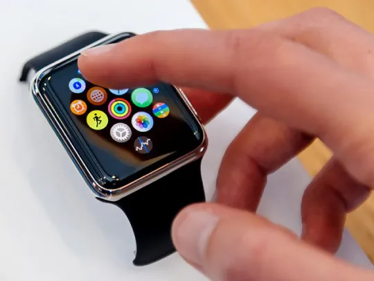 A Boubyan customer using a smartwatch to access the Boubyan app and make payment.
